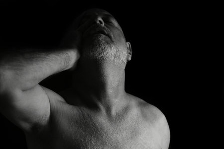 adult man facial and body expression black and white photo silhouette art composition imageの写真素材