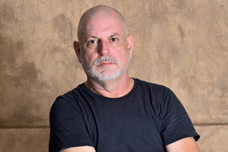 adult man bald white beard face expression male model gentleman in black clothing image