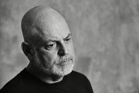 portrait adult man bald white beard face expression happy thoughtful male model gentleman in black clothes image.の写真素材