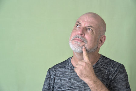 portrait adult man bald white beard face expression happy thoughtful male model gentleman in black clothes image.の写真素材