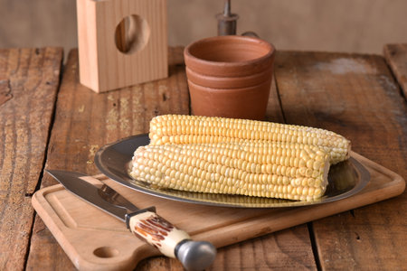 corn natural food healthy delicious vegan cooked green corn on wooden table tasteの写真素材