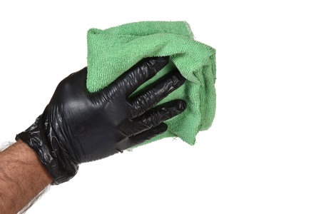 hand with black latex glove holding fabric towel doing cleaning removes dirt isolated on white transparent background imageの写真素材