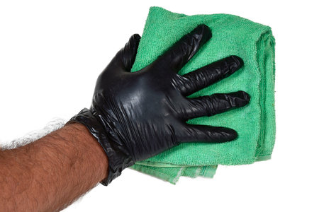 hand with black latex glove holding fabric towel doing cleaning removes dirt isolated on white transparent background imageの写真素材