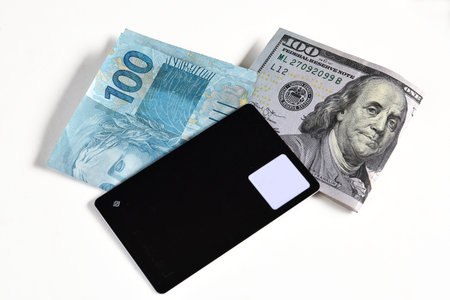 Goiania, Brazil February 24, 2025: dollar and Brazilian real banknotes financial value