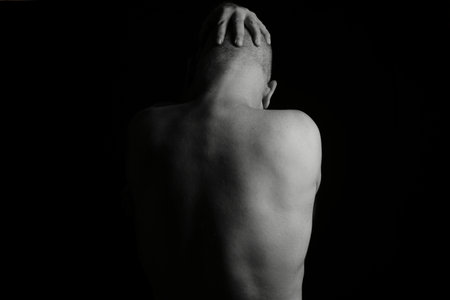 man doing stretching exercises yoga calisthenics muscular fitnessの写真素材