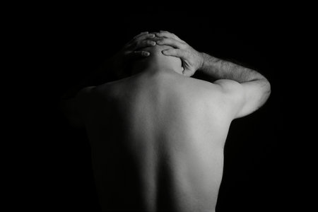 man doing stretching exercises yoga calisthenics muscular fitnessの写真素材