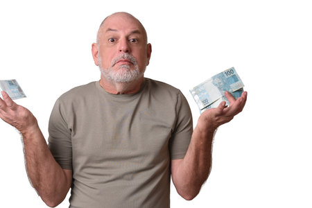 GoiÃ¢nia, Brazil, September 17, 2025: Financial value of Brazilian real notes. Man holding money in banknote. Economy.の写真素材