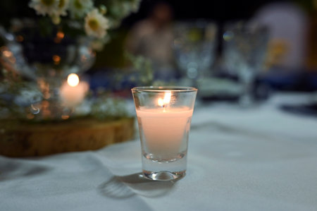 buffet table with dishes, candles, arrangements and decorationの写真素材
