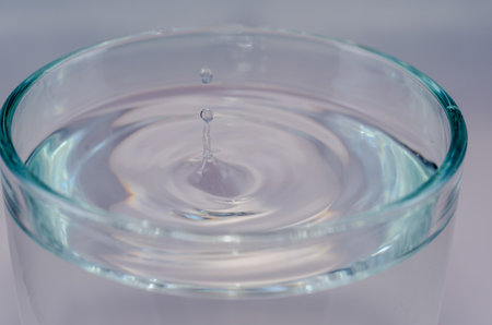 little water drop in a glass sharpの写真素材