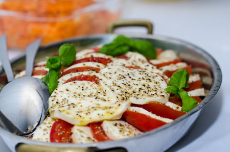 tomato salad with pepper in a bowlの写真素材