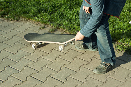 boy learns to ride a skateboardの写真素材