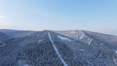 Frozen hills winter road aerial viewの写真素材