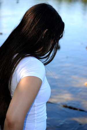 A young girl near the lakeの写真素材