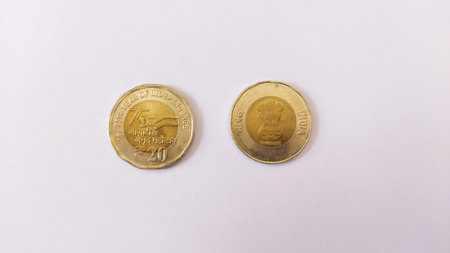 20 rupees coins on white background. Both head and tail side of twenty rupees indian coin.の写真素材