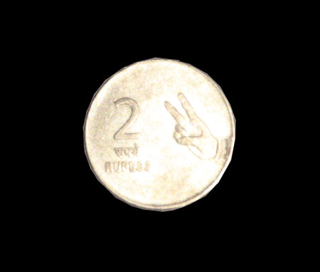 Top view of 2 rupee Indian coin. Tail side of two rupee Indian coin on black background