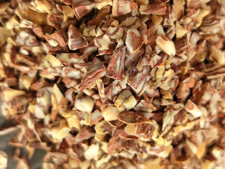 Supari a popular form of betel nut in India, where small pieces are sold in packets or pouches, often mixed with tobacco and other ingredients. Close up of small ingredients of supの写真素材