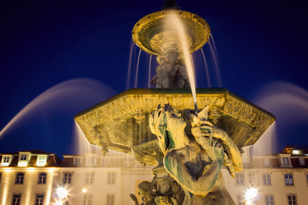 Fountain in Rossio square Lisbon at night time, Portugalの写真素材