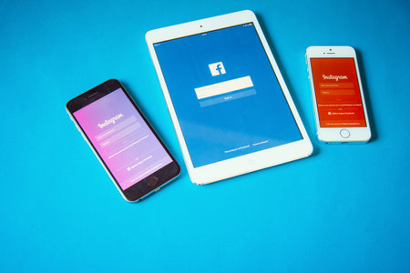 Kyiv, Ukraine - January 24, 2016: Top view of devices with social networks on blue backgroundのeditorial素材