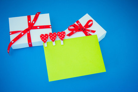 Gift boxes and envelope on blue backgroundの写真素材