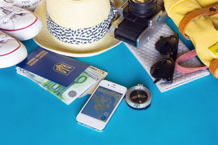 KYIV, UKRAINE - MAY 20, 2016: Different objects for traveling with Google maps on blue backgroundのeditorial素材