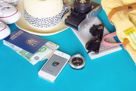 KYIV, UKRAINE - MAY 20, 2016: Different objects for traveling with Google maps on blue backgroundのeditorial素材