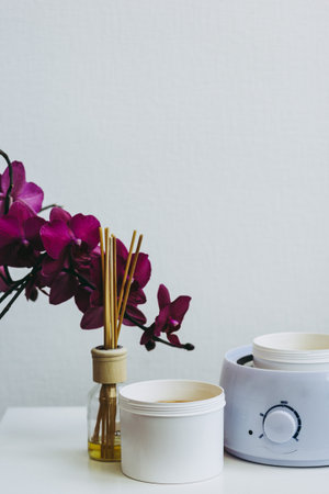 Orchid flower, aromatic sticks and paste for sugaring in beauty salonの写真素材