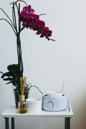 Orchid flower, aromatic sticks and paste for sugaring in beauty salonの写真素材