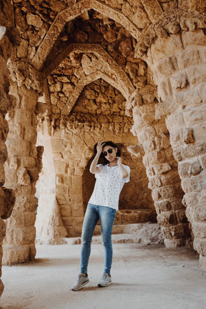 Young woman posing in Park Guell, Barcelona, Spain