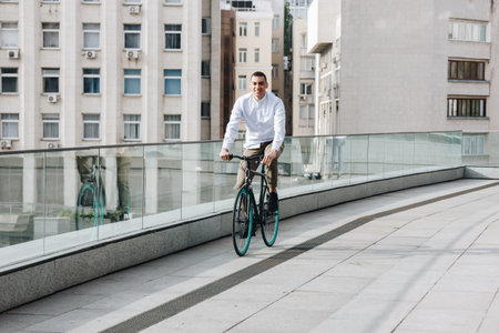 Mixed race hipster man riding a bicycle in the city