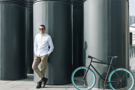 Mixed race hipster man  with bicycle in the cityの写真素材