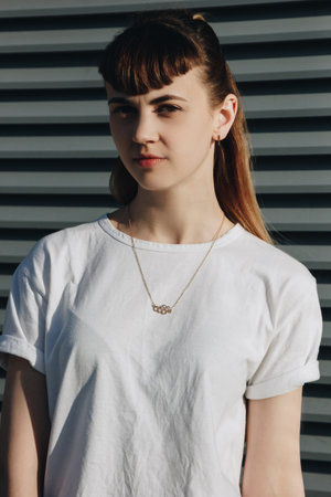 Portrait of a beautiful hipster girl in white t-shirt