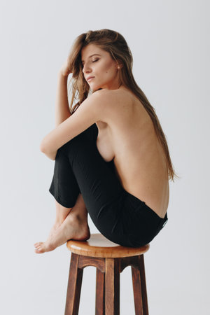 Topless young caucasian woman on white backgroundの写真素材