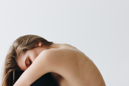 Topless young caucasian woman on white backgroundの写真素材