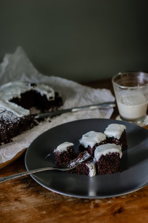 Chocolate brownie cakes with cream on plateの写真素材