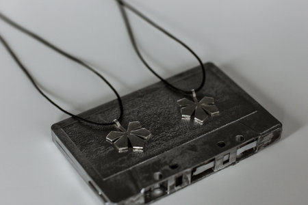 Silver chestnut leaf shape pendants on cassetteの写真素材