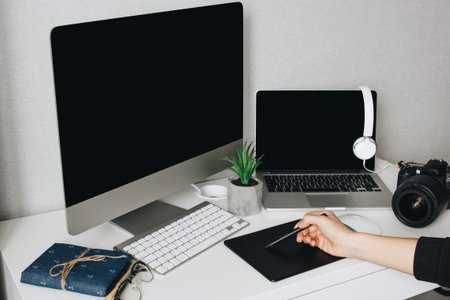 Professional designer working at home using graphic tabletの写真素材