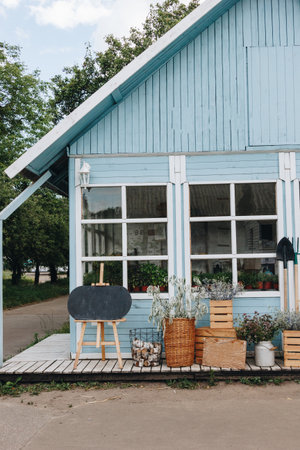 Little blue house in the gardenの写真素材