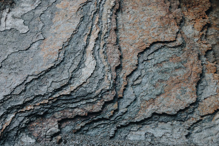 Dark rock texture with cracksの写真素材