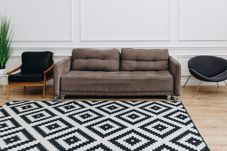 Couch and armchairs in light room