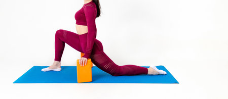Unrecognizable caucasian woman doing exercises with blocks on white backgroundの写真素材
