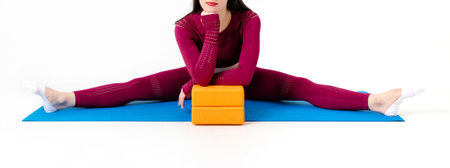 Unrecognizable caucasian woman doing exercises with blocks on white backgroundの写真素材