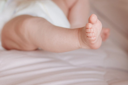 Close-up of small baby legsの写真素材