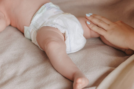 Mother holding baby feet in her handsの写真素材