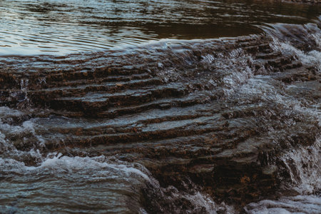 Mountain river surface with rocks