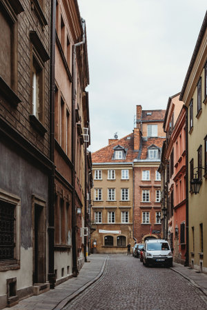 Warsaw, Poland - 16 October, 2015: Narrow street of old town with colorful buildings in Warsaw