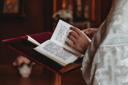 Priest reading from bible during ceremony