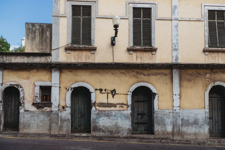 Old weathered timeworn shabby house front in Funchal city, Madeira island