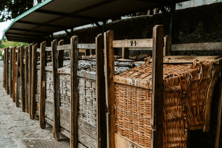 Traditional wicker Toboggans sledges at the famous tourist attraction Monte in Funchal on the island Madeiraの写真素材