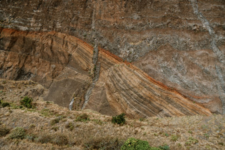 Brown, red, orange and gray stone rock granite basalt texture background. Mountains surfaceの写真素材