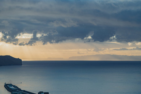 Sunrise over the Atlantic ocean in Funchal, Madeira island, Portugalの写真素材